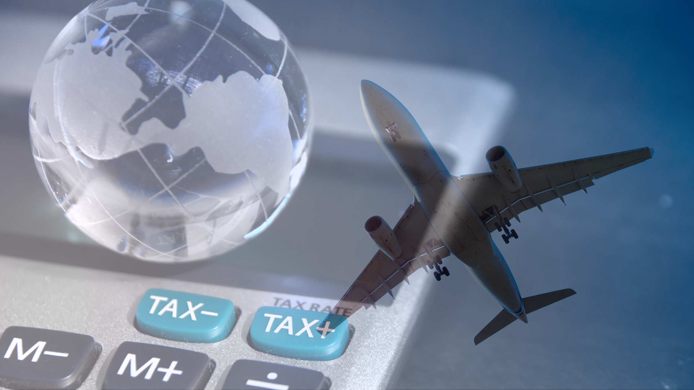 Glass world ball on a calculator, transparent plane flying over the image.
